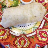 The Kitchen Sink Burrito · Our famous classic.  Your choice of meat wrapped into a Supreme Burrito:  Rice, beans, meat,...