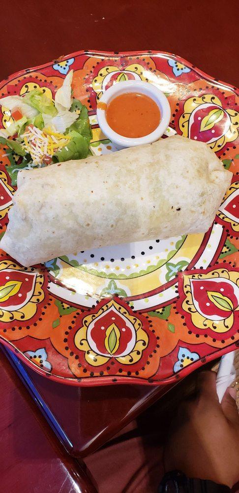 The Kitchen Sink Burrito · Our famous classic.  Your choice of meat wrapped into a Supreme Burrito:  Rice, beans, meat, lettuce, tomato, sour cream, cheese and guacamole.  Try it wet with Green or Red Sauce and Melted Mexi Cheese on top