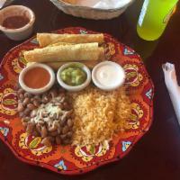 Taquitos · 3 cripsy Taquitos perfectly golden fried and served with rice and beans.