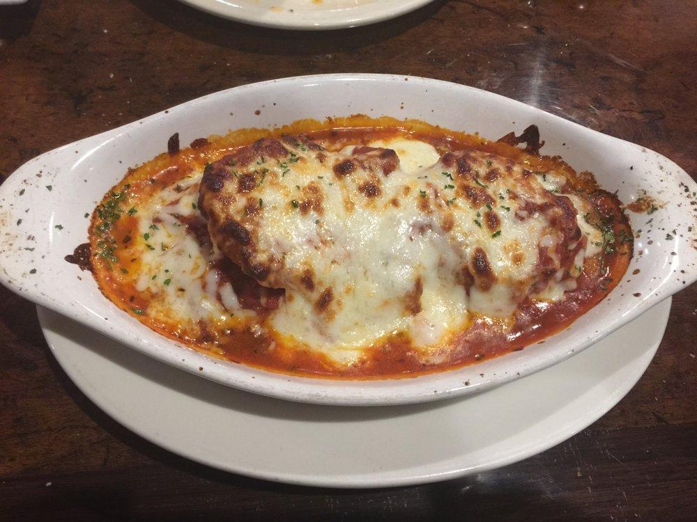 Parmigiana · seasoned chicken breast or Veal  topped with our traditional Marinara sauce and mozzarella cheese on top,  served with spaghetti and our classic marinara sauce