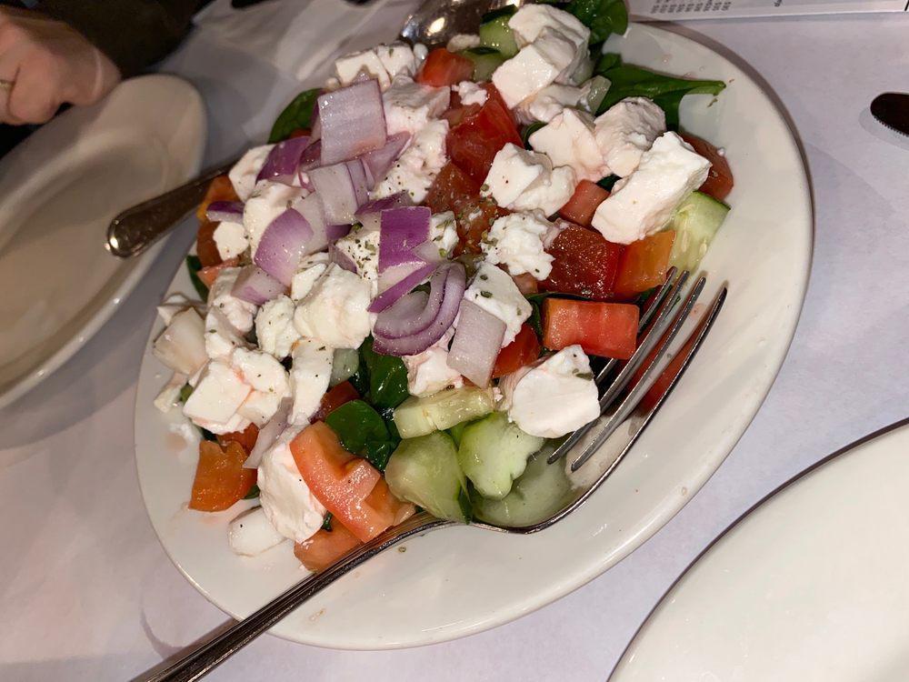Chopped Salad · Over shad or romaine, diced tomato and cucumber, onion, mozzarella, finished in a red wine vinaigrette.
