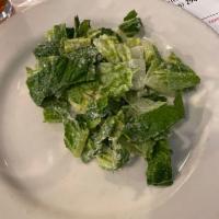 Caesar Salad · Hearts of romaine in a homemade dressing with croutons.
