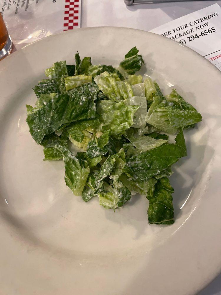 Caesar Salad · Hearts of romaine in a homemade dressing with croutons.
