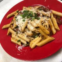 The Rasta Pasta · Penne pasta noodles, mixed in a cream sauce with spicy jerk seasoning, red and green bell pe...