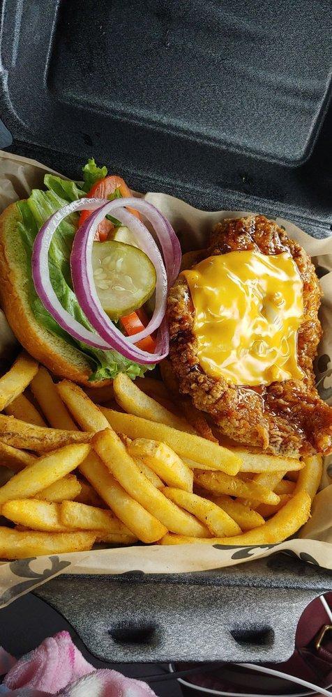 The Earl of Chicken Sandwich · Fried or grilled chicken breast topped with honey pepper BBQ sauce and cheese. Comes with lettuce, tomato, pickles, onions and choice of fries or tots.