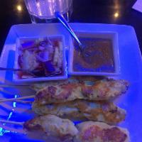 2 Chicken Satay · Skewers of grilled, curry marinated chicken; Served with peanut sauce and cucumber salad. Gl...