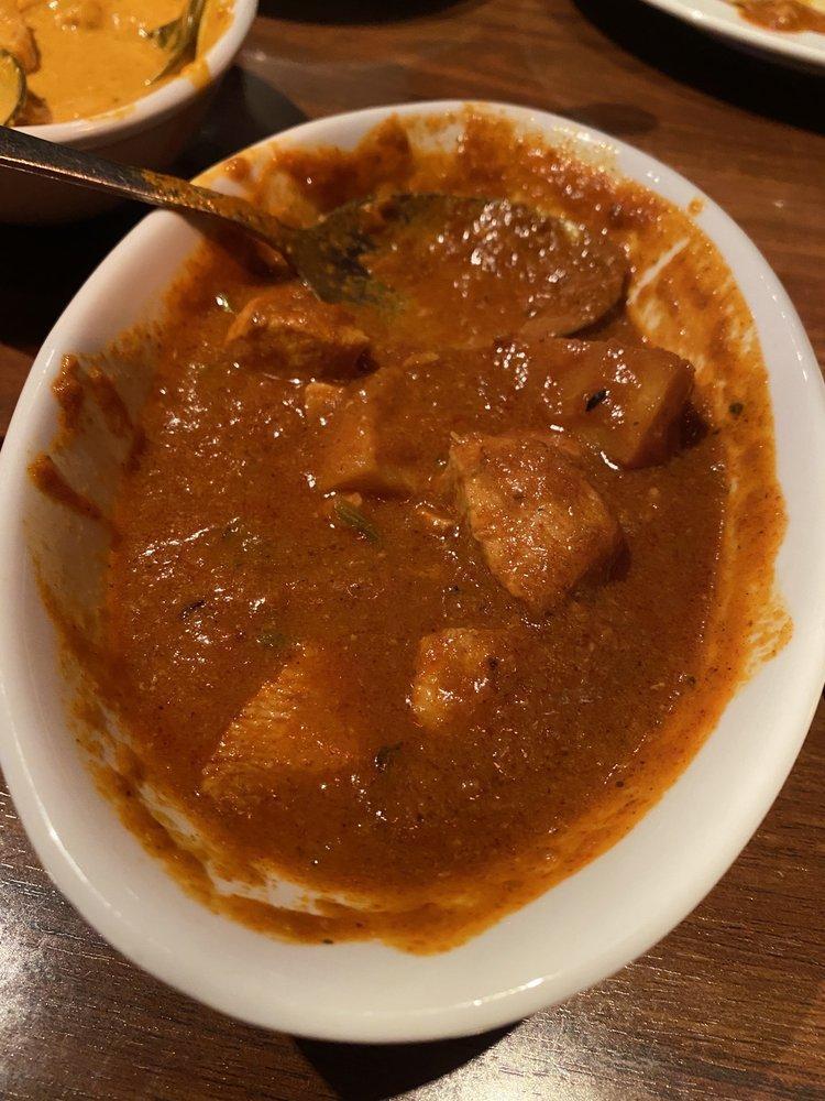 Chicken Vindaloo · Extra spiced chicken cooked with tomatoes in a tangy and lightly spiced sauce. Extra hot.