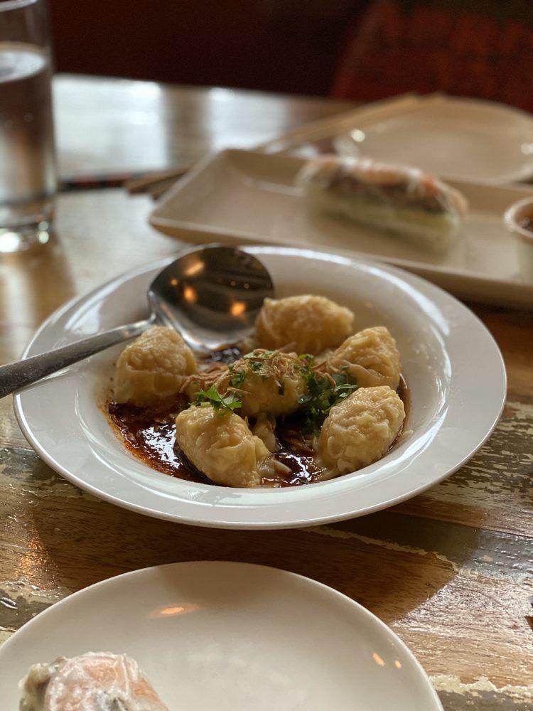 Wonton Dumplings · Shrimp and pork, chili oil, shallot, and cilantro.
