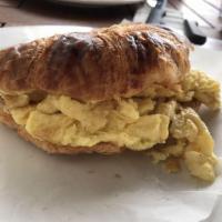 Egg Croissant · Scrambled eggs with melted gruyere cheese. Served with baguette jelly and butter and mixed g...