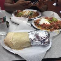Monster Burrito · Choice of 2 Meats,Rice, Beans, Lettuce, Sour Cream, Cheese, Pico de Gallo, Guacamole