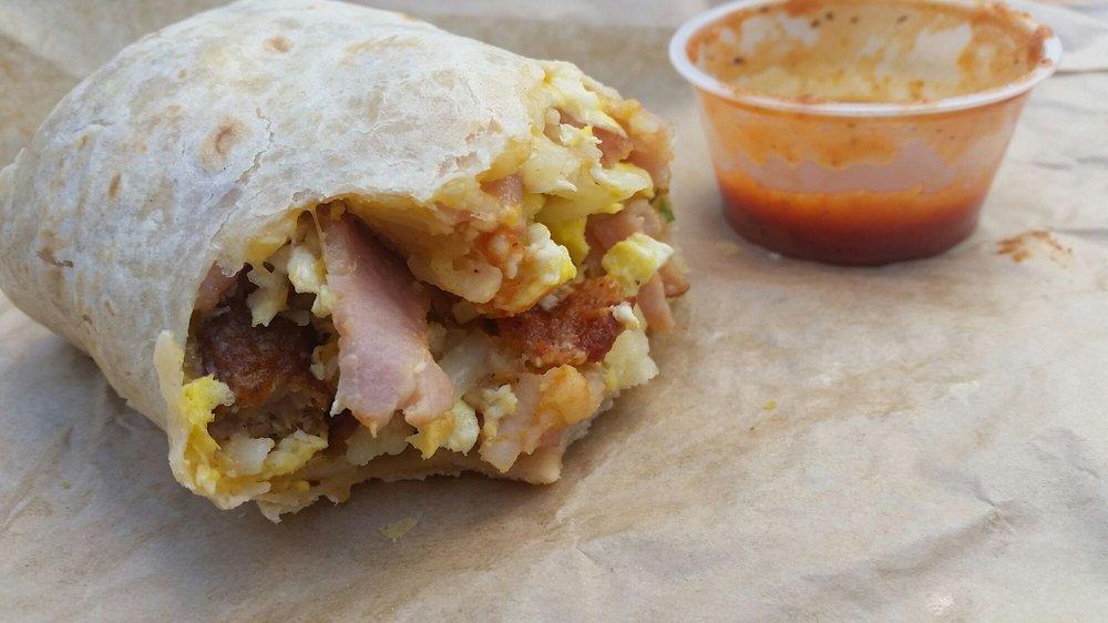 World Famous Classic Burrito · Bacon, ham, sausage, eggs, shredded cheddar jack cheese and hash browns.