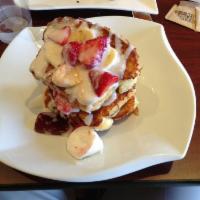 Stuffed French Toast Tower · 3 thick slices of brioche bread layered with bananas, strawberries, cream cheese and strawbe...