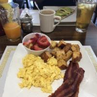 American Breakfast · 2 eggs any style, house potatoes, turkey bacon and fresh fruit.