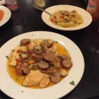 Chicken Scarpiello · Chicken breast sauteed with hot cherry peppers and sausage in a white wine sauce.