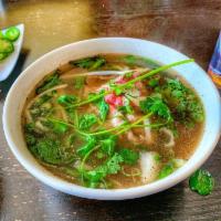 Rare Steak Pho · Rare beef slices in spiced beef broth. Rice noodles with onions, lime wedge, bean sprouts, j...