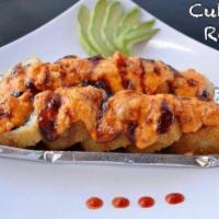 Culichi Roll · Relleno de carne y base, cubierto con queso chihuahua y Siracha. Stuffed with grilled beef a...