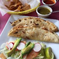 Quesadillas · Order of 3 corn quesadillas, crispy shell or soft. Topped with lettuce, sour cream and cheese.