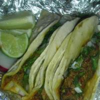 3 Chorizo Tacos · Spicy pork sausage. Soft shell tacos. They can be mixed, and topped with chopped onion and c...