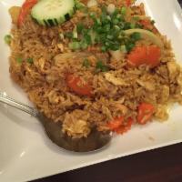 Pineapple Fried Rice · Stir-fried rice with eggs, carrot, green onion, pineapple, tomato, curry powder and roasted ...