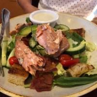 Smoked Salmon BLT Salad · Crisp iceberg, spinach, soft croutons, avocado dressing, cucumber, bacon, avocado, grape tom...
