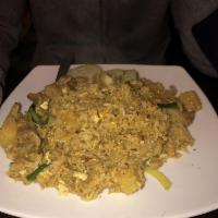 Pineapple Fried Rice · Thai fried rice with egg, pineapple, curry powder, cashews, onion and scallions.