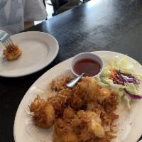 Coconut Shrimp · Butterfly shrimp in coconut butter with sweet and sour sauce.