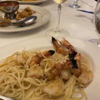 Shrimp Scampi · Shrimp broiled in garlic, butter, wine and lemon sauce. Served with rice.