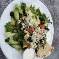 Michigan Cherry Salad · Leafy greens topped with dried cherries, walnuts, blue cheese, tomatoes, cucumbers, and appl...