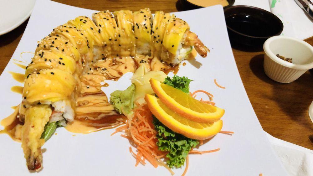 Dragon Roll · Asparagus, shrimp tempura, masago and avocado.