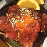 Tuna Tartar · Diced tuna, avocado, masago, sesame seeds, scallions with hot oil, kimchee and vinegar sauce.
