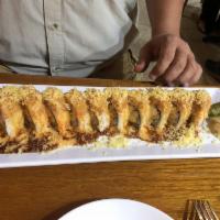 Miami Heat Roll · White fish tempura, avocado, crab salad top with white fish salad.
