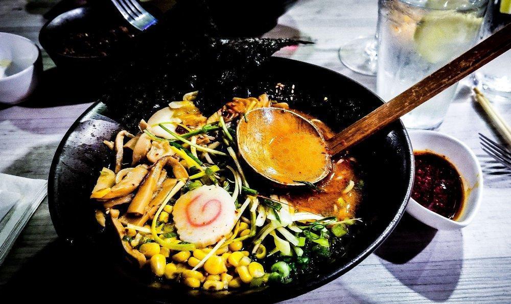 Toryumon House Ramen · Chashu, scallions, egg, corn, bamboo shoot, garlic chip, bacon, sesame seed, spicy sauce, nori, bean sprout and red paper.