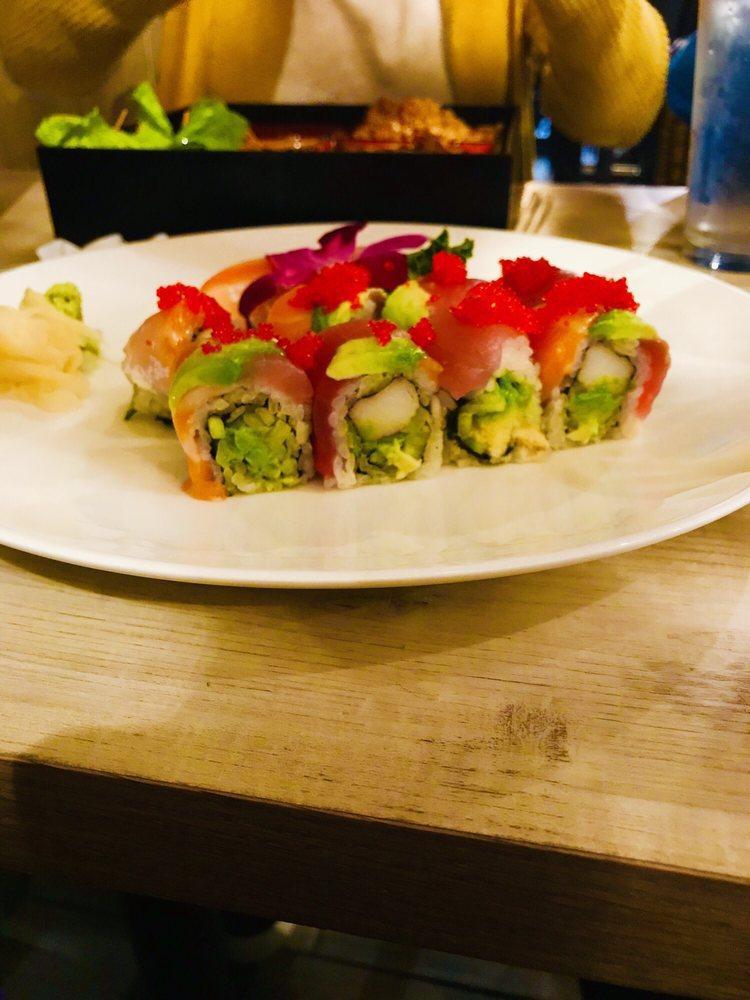 Rainbow Roll · Kani, avocado, cucumber, topped with tuna, salmon, yellowtail and tobiko.