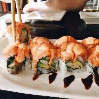 Orange Blossom Roll · Shrimp and avocado topped with salmon and spicy eel sauce. Mild spicy.