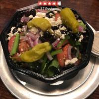 Greek Salad · Romaine lettuce, tomatoes, black olives, red onions, green peppers, feta cheese and pepperon...