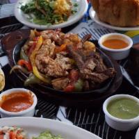 Fajitas · Choice of chicken, beef or shrimp sauteed with tomato, onion and bell peppers and pico de ga...