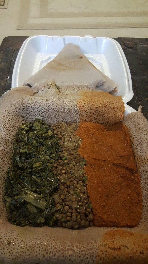 Gomen · With Ethiopian's bread (injera). Fresh chopped collard greens cooked with onion and garlic (mild).