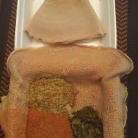 Green Lentil Salad · With Ethiopian's bread (injera). Green lentils cooked and mixed with minced onion and jalape...