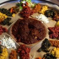 Beef Wot · Ethiopian's bread (injera). Cubes of beef simmered with berbere (red pepper and onion), with...