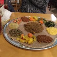 Lamb Alicha · Ethiopian's bread (injera). Lean succulent cubes of lamb simmered in an onion and ginger wit...