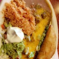 Smothered Burrito · Filled with beans, green or red chile sauce with pork.