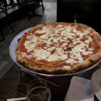 Margherita Pizza · Fresh mozzarella, tomato sauce and basil.