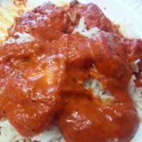 Chicken Tikka Masala · Boneless pieces of tandoori chicken smothered in rich onions and tomato gravy, flavored with...