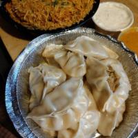 Momo · Typical Nepali style chicken or veggie and dumplings with fresh coriander, ginger and garlic...