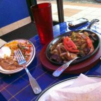 Steak Fajitas · Served with bell pepper, onions, sour cream, pico de gallo, flour tortilla rice, and refried...