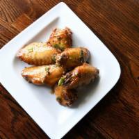 Vietnamese Wings · Canh ga chien nuoc mam. Crispy chicken wings fried with house-made sweet garlic fish sauce.