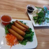 Firecracker Shrimp · Cha gio tom. Deep-fried shrimp wrapped in egg rolls. Served with sweet chili sauce. Contains...