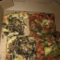 Vegan Truffle Oil Pizza · Vegan cheese. Organic Italian tomato sauce, mushrooms, oregano, garlic and seasonal veggies.