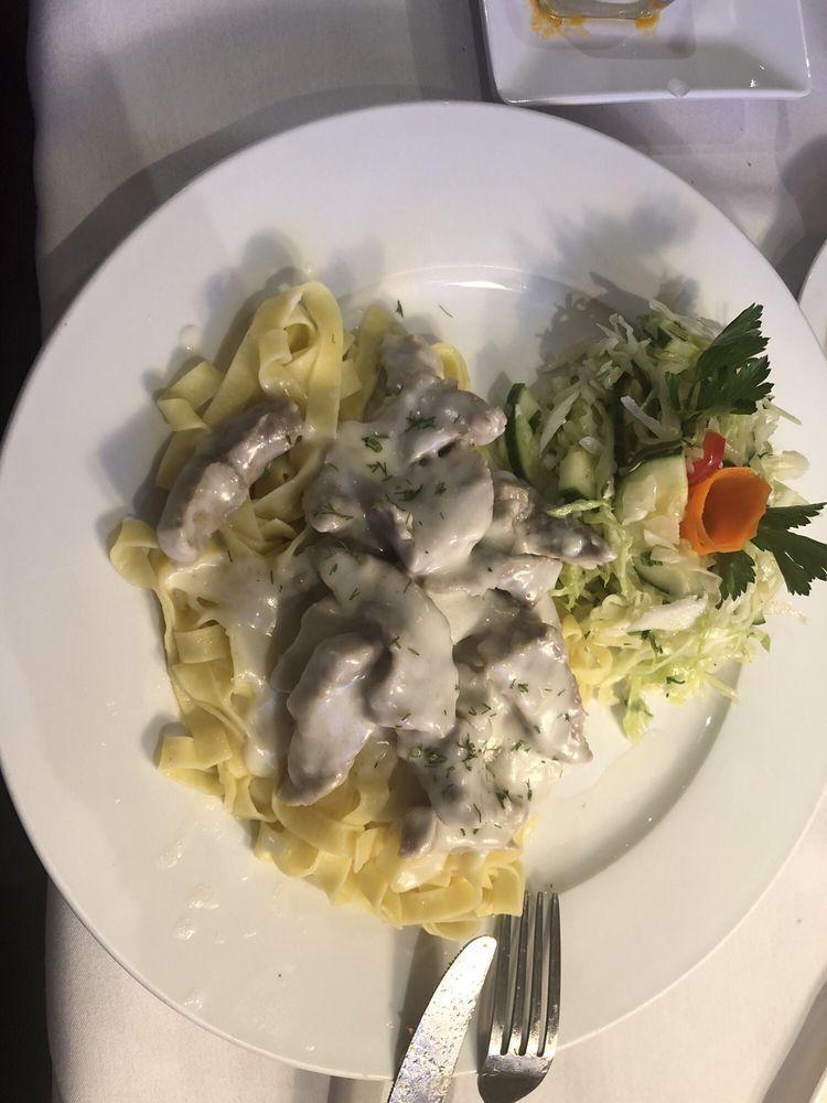 Beef Stroganoff · Italian fettuccini pasta served with broiled beef in white sauce with a side of garden salad.