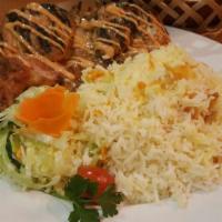 Tabaka Chicken · Tender and succulent Cornish game hen grilled in the Georgian style served with rice and sal...